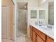 Bathroom featuring an open shower and a vanity with a stylish countertop and cabinet at 7005 River Hammock Dr # 301, Bradenton, FL 34212