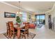 Bright living area features modern furnishings and a sliding glass door leading to a balcony at 7005 River Hammock Dr # 301, Bradenton, FL 34212