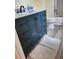 Stylish bathroom with dark vanity and modern fixtures at 7050 Sunset S Dr # 601, South Pasadena, FL 33707