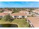 Aerial view of a condo building showcasing its rear elevation and surrounding landscape at 7325 Skybird Rd, Bradenton, FL 34209