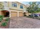 Townhouse complex with paver driveway and attached garages at 7325 Skybird Rd # 7325, Bradenton, FL 34209