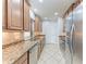 Modern kitchen with granite countertops and stainless steel appliances at 7325 Skybird Rd, Bradenton, FL 34209