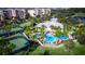 Aerial view of community pool, tennis courts, and clubhouse at 7398 Marathon Dr, Seminole, FL 33777