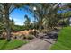 Landscaped walking path with trees and lighting at 7398 Marathon Dr, Seminole, FL 33777