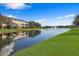 Lakefront view of community with water fountain at 7398 Marathon Dr, Seminole, FL 33777