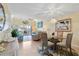 Bright dining area with glass table and coastal-themed decor at 755 Village Cir # 203, Venice, FL 34292