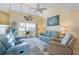 Spacious living room featuring comfortable seating and coastal decor at 755 Village Cir # 203, Venice, FL 34292