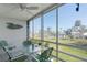 Enjoy the view from this screened porch overlooking the pool and lush landscaping at 755 Village Cir # 203, Venice, FL 34292