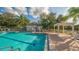 Inviting community pool with a cabana and lounge area, perfect for enjoying the outdoors at 7703 Whitebridge Gln, University Park, FL 34201