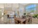 Inviting dining room featuring a wooden table with seating for six and large window at 7703 Whitebridge Gln, University Park, FL 34201