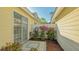 Private patio featuring manicured landscaping providing a serene outdoor space at 7703 Whitebridge Gln, University Park, FL 34201