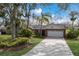 Front view of a brick ranch home with a white garage door at 8009 55Th E St, Palmetto, FL 34221