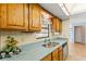 View of kitchen sink, wood cabinets and a window overlooking the outdoors at 8009 55Th E St, Palmetto, FL 34221