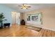 Living room with hardwood floors, bay window and ceiling fan at 8009 55Th E St, Palmetto, FL 34221