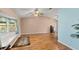 Living room with wood floors, a bay window, and neutral walls at 8009 55Th E St, Palmetto, FL 34221