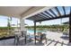 Relaxing patio area with seating near the pool at 8572 Daybreak St, Sarasota, FL 34241