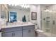 Double vanity bathroom with a large walk in shower at 8716 Winter Breeze Way, Sarasota, FL 34241