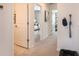 Home hallway with doors to bedrooms and a pet bed at 8716 Winter Breeze Way, Sarasota, FL 34241