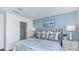 Bright bedroom featuring a king-size bed and ensuite access at 8724 Winter Breeze Way, Sarasota, FL 34241