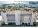 Aerial view of a white building with waterfront and city views at 33 S Gulfstream Ave # 808, Sarasota, FL 34236