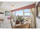 Dining area with a table and chairs, offering a scenic view at 33 S Gulfstream Ave # 808, Sarasota, FL 34236