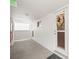 Hallway entrance with white walls and a seashell wreath at 33 S Gulfstream Ave # 808, Sarasota, FL 34236