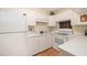 Bright kitchen with white cabinets and appliances at 33 S Gulfstream Ave # 808, Sarasota, FL 34236