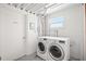 Shared laundry room with washer and dryer at 33 S Gulfstream Ave # 808, Sarasota, FL 34236