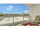 Private balcony with chairs and view of rooftops at 1000 Longboat Club Rd # 304, Longboat Key, FL 34228