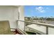 Private balcony with chairs and view of neighborhood at 1000 Longboat Club Rd # 304, Longboat Key, FL 34228