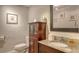 Well-appointed bathroom with granite vanity and updated fixtures at 1000 Longboat Club Rd # 304, Longboat Key, FL 34228