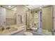 Clean bathroom with shower/tub combo and updated vanity at 1000 Longboat Club Rd # 304, Longboat Key, FL 34228