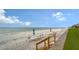 Beach access with lounge chairs and umbrellas at 1000 Longboat Club Rd # 304, Longboat Key, FL 34228