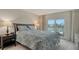 Main bedroom with sliding glass doors to outdoor patio at 1000 Longboat Club Rd # 304, Longboat Key, FL 34228