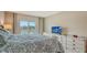 Comfortable main bedroom with private balcony access at 1000 Longboat Club Rd # 304, Longboat Key, FL 34228