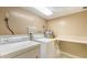 Convenient laundry room with washer and dryer hookups at 1000 Longboat Club Rd # 304, Longboat Key, FL 34228