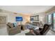 Comfortable living room with TV and access to balcony at 1000 Longboat Club Rd # 304, Longboat Key, FL 34228