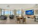 Relaxing lounge area with ocean views and large TV at 1000 Longboat Club Rd # 304, Longboat Key, FL 34228