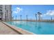 Inviting swimming pool with ocean views and ample lounge space at 1000 Longboat Club Rd # 304, Longboat Key, FL 34228