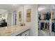 Spacious walk-in closet with ample shelving and hanging space at 1000 Longboat Club Rd # 304, Longboat Key, FL 34228