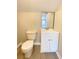 Clean bathroom with white vanity and updated fixtures at 10607 3Rd St, Thonotosassa, FL 33592