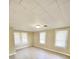 Well-lit bedroom with neutral walls and window blinds at 10607 3Rd St, Thonotosassa, FL 33592