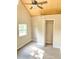 Bright bedroom with vaulted ceiling, wood-look floors, and closet at 10607 3Rd St, Thonotosassa, FL 33592