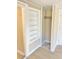 Built-in shelving and closet with hanging rod at 10607 3Rd St, Thonotosassa, FL 33592