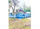 Front view of a charming light blue house at 10607 3Rd St, Thonotosassa, FL 33592