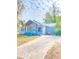 Light blue house with a new paver driveway at 10607 3Rd St, Thonotosassa, FL 33592