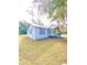 Side view of a charming light blue house at 10607 3Rd St, Thonotosassa, FL 33592