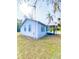 Side view of a charming light blue house at 10607 3Rd St, Thonotosassa, FL 33592