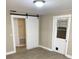 Living room with barn door and access to other rooms at 10607 3Rd St, Thonotosassa, FL 33592