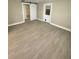 Open living area with barn door and new flooring at 10607 3Rd St, Thonotosassa, FL 33592